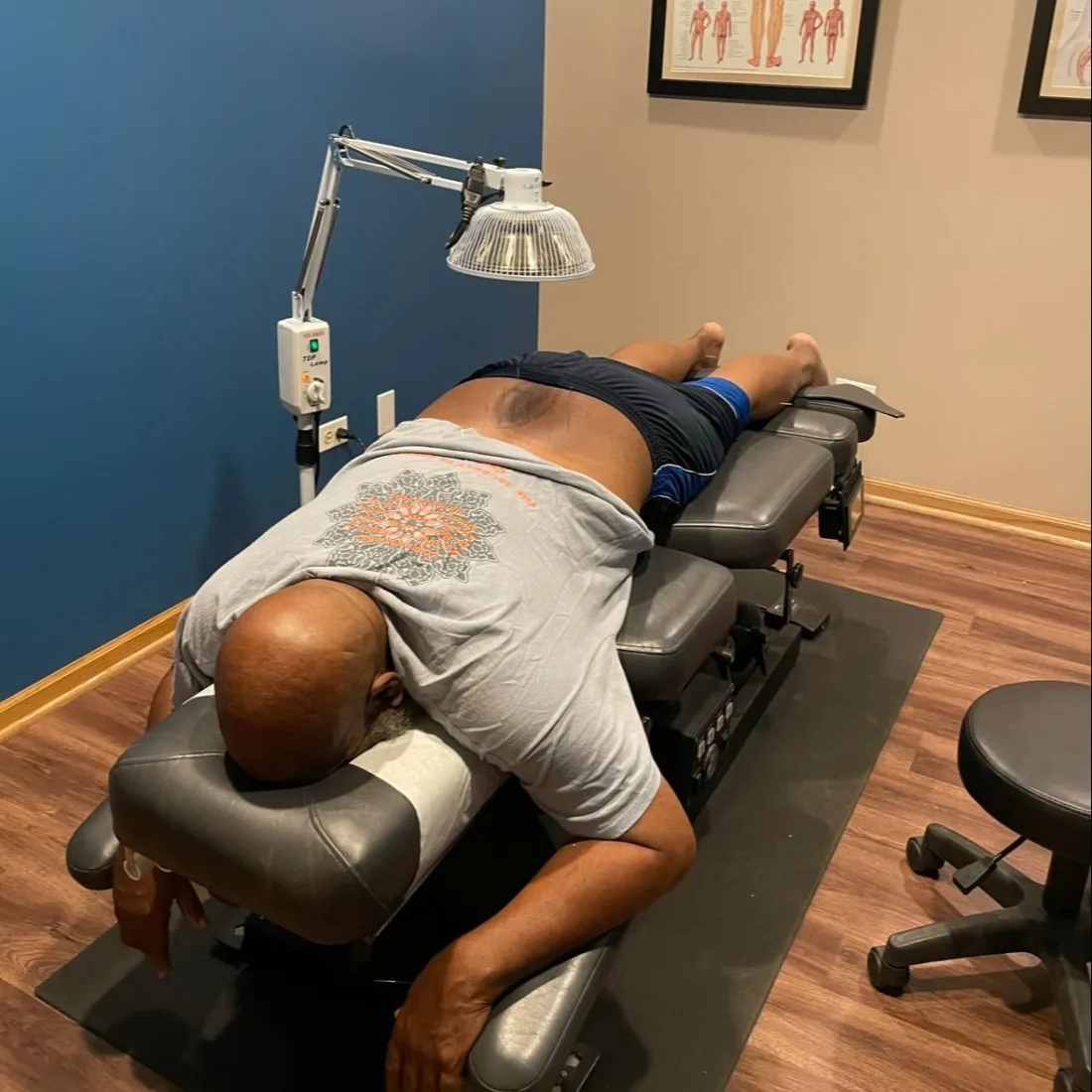 Anodyne infrared light therapy pads on the feet at Juarez Chiropractic in Chicago