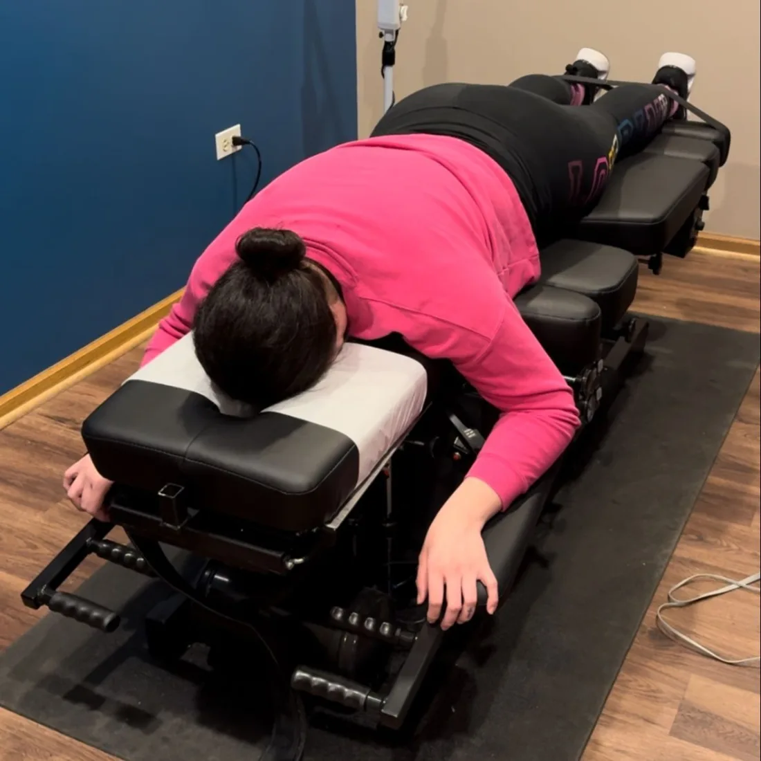 Gentle flexion distraction spinal decompression on a segmented table at Juarez Chiropractic in Chicago